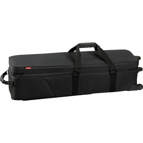 A black hard-shell instrument carrying case with a top handle, side carry handle, and small red brand tab, shown on a plain white background.